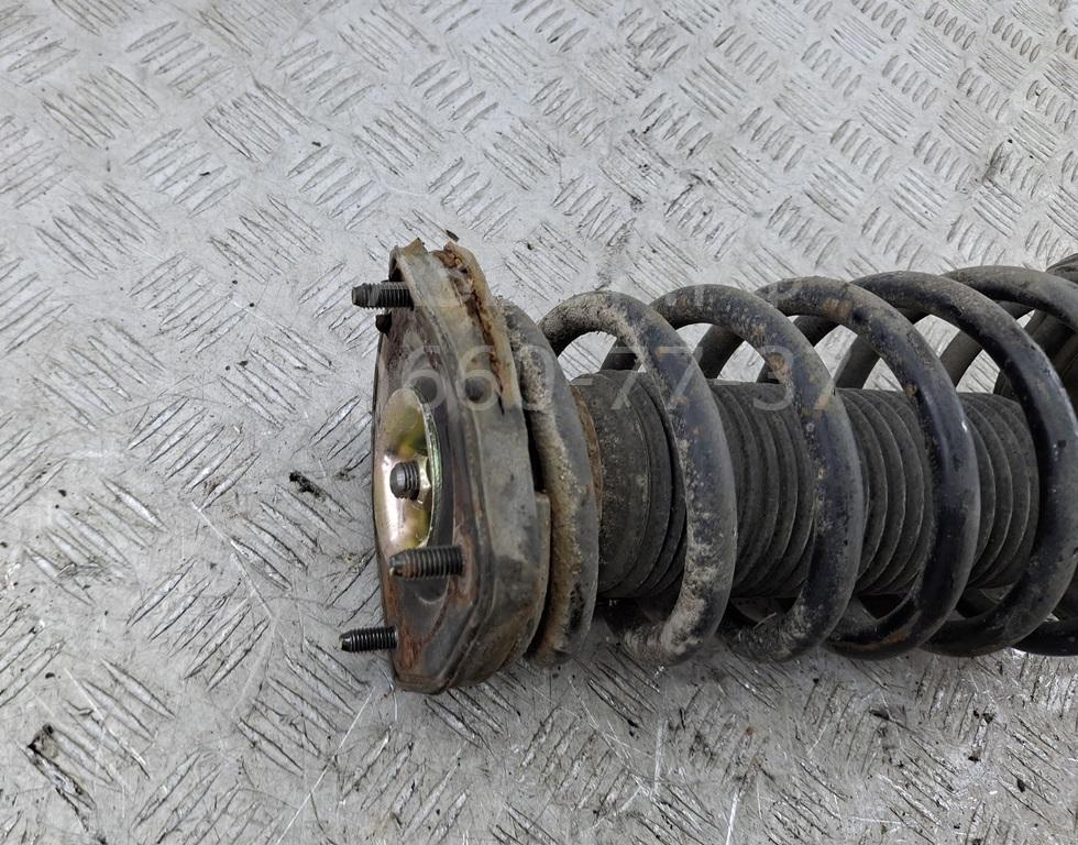 Амортизатор задний левый