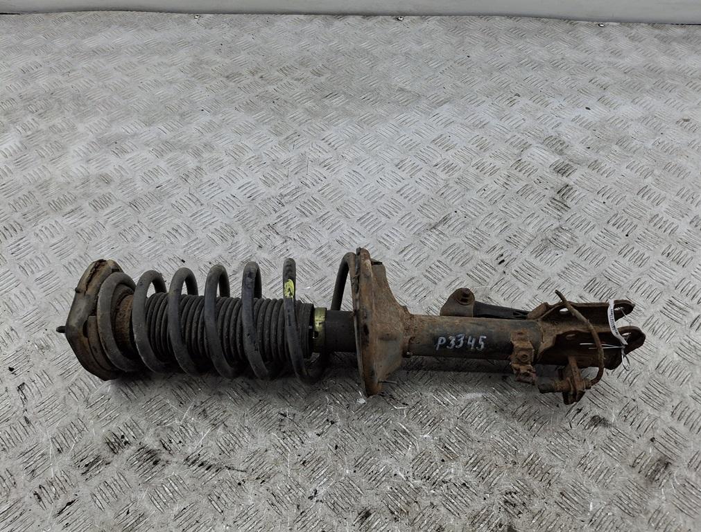 Амортизатор задний левый