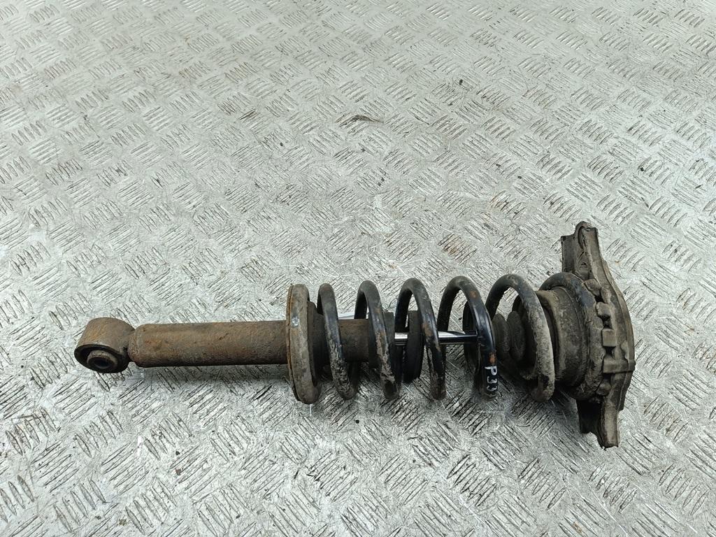 Амортизатор задний левый