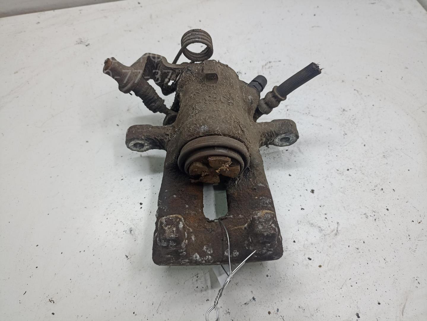 Суппорт задний левый