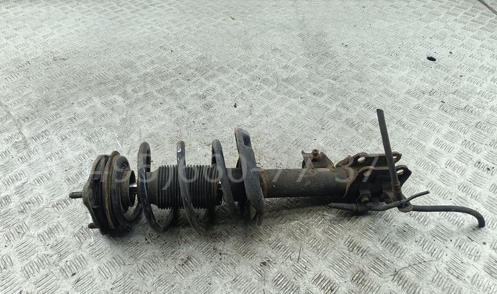 Амортизатор передний левый