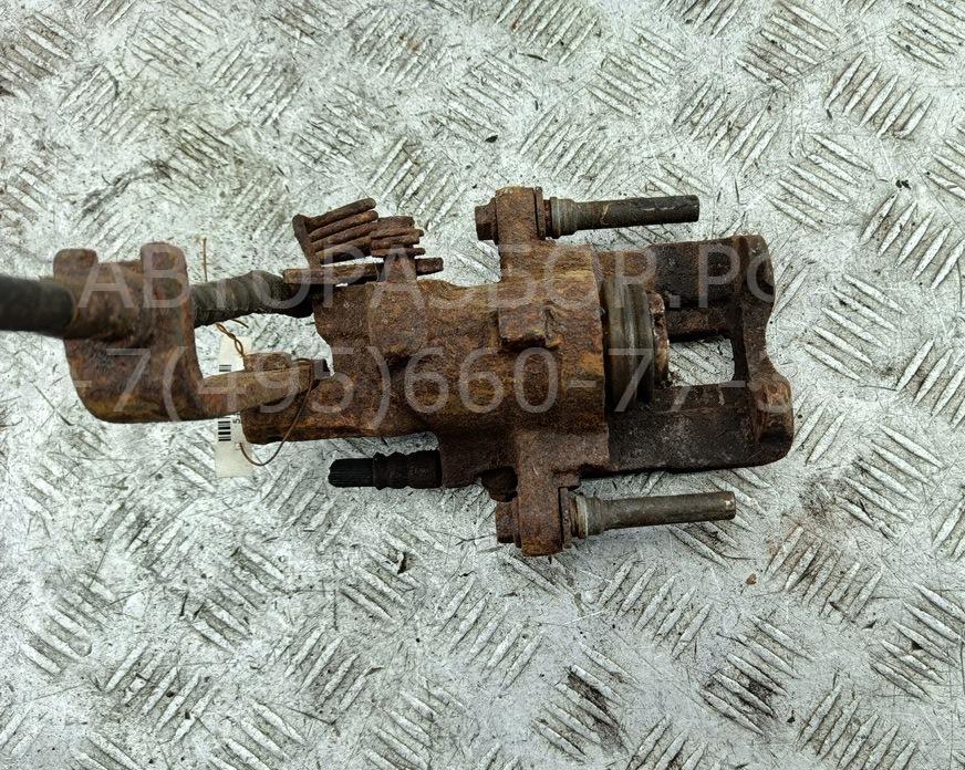 Суппорт задний левый