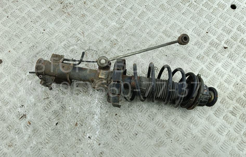 Амортизатор передний левый