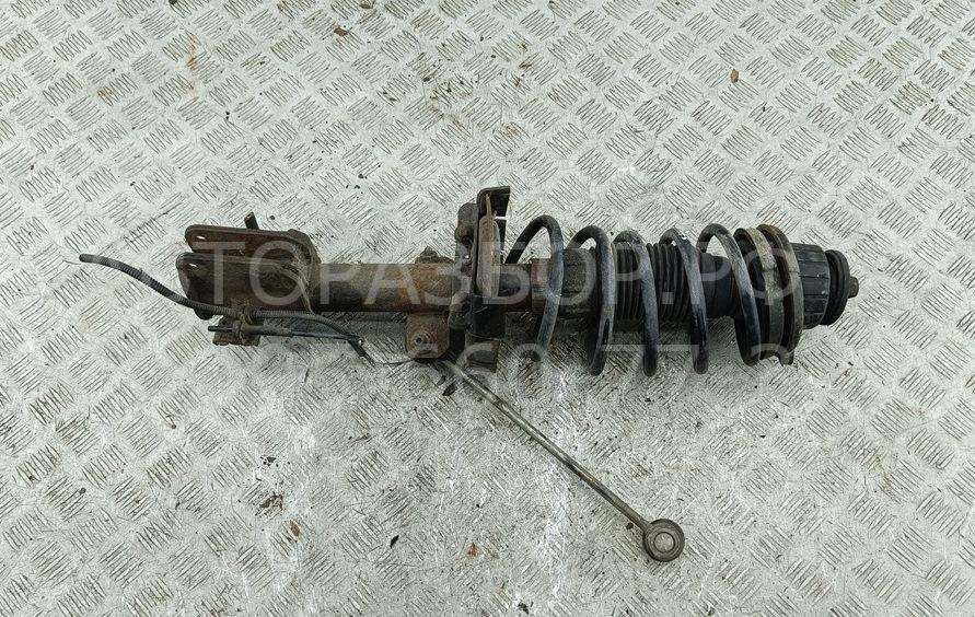 Амортизатор передний левый