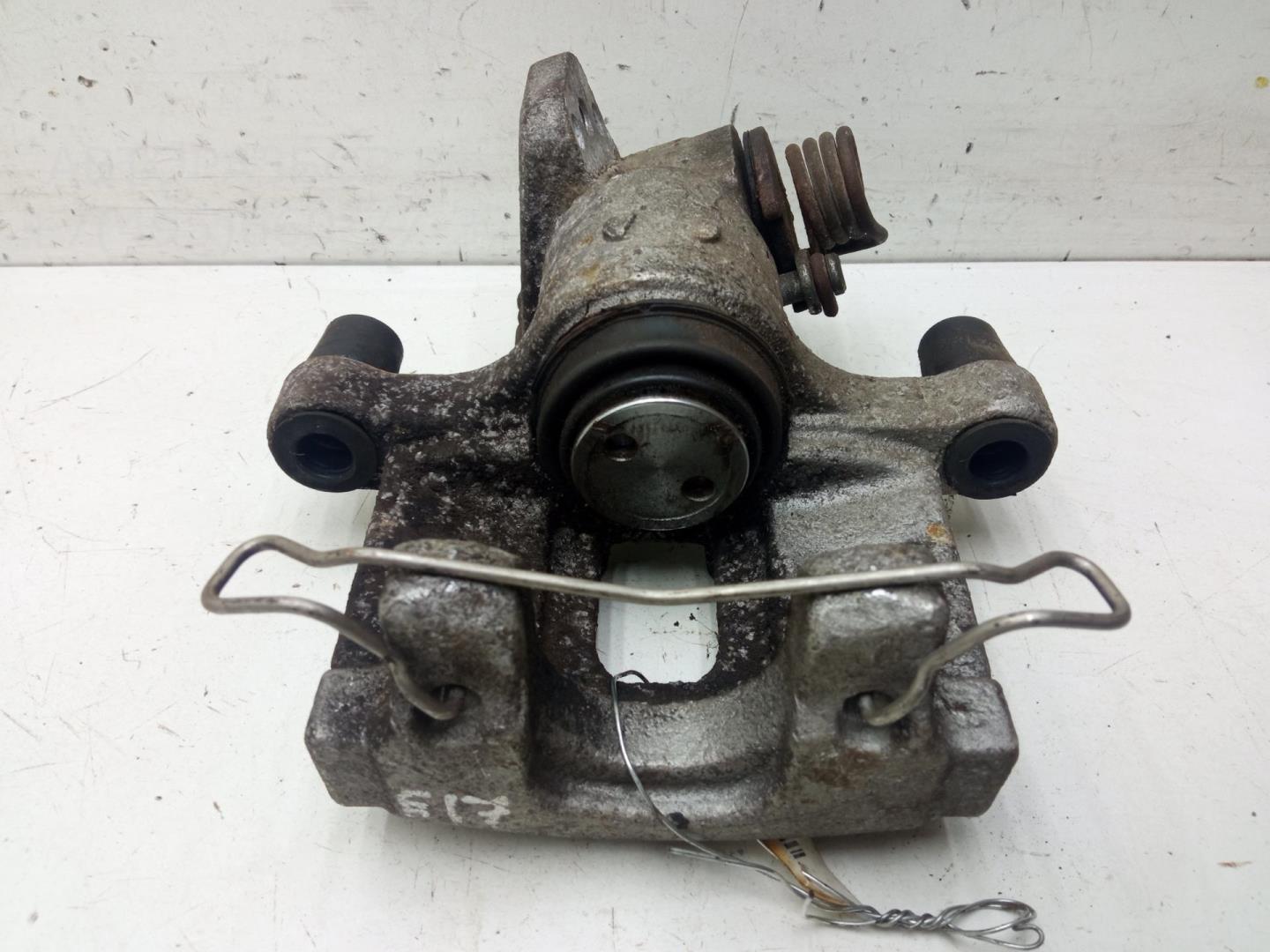 Суппорт задний левый