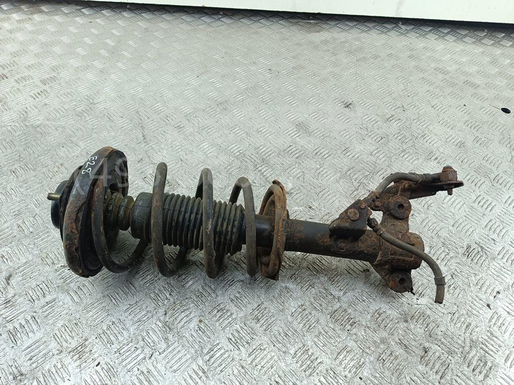 Амортизатор передний левый