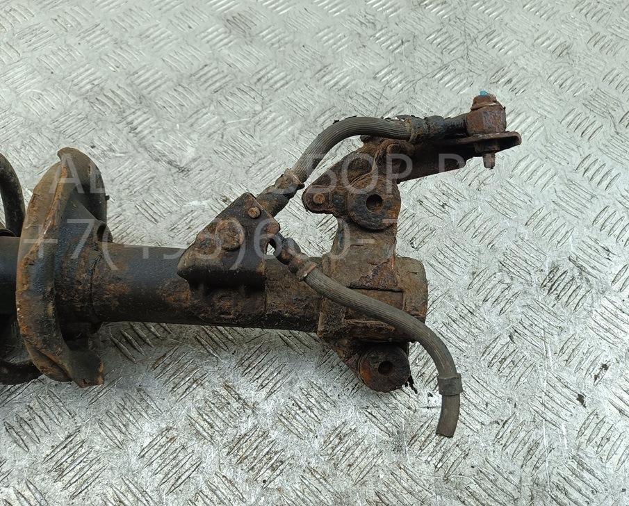 Амортизатор передний левый