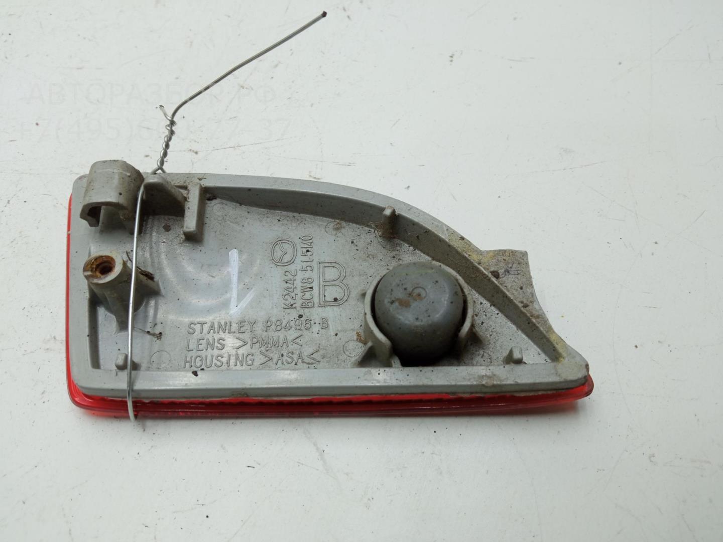 Отражатель в бампер задний левый