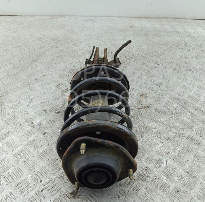 Амортизатор передний левый