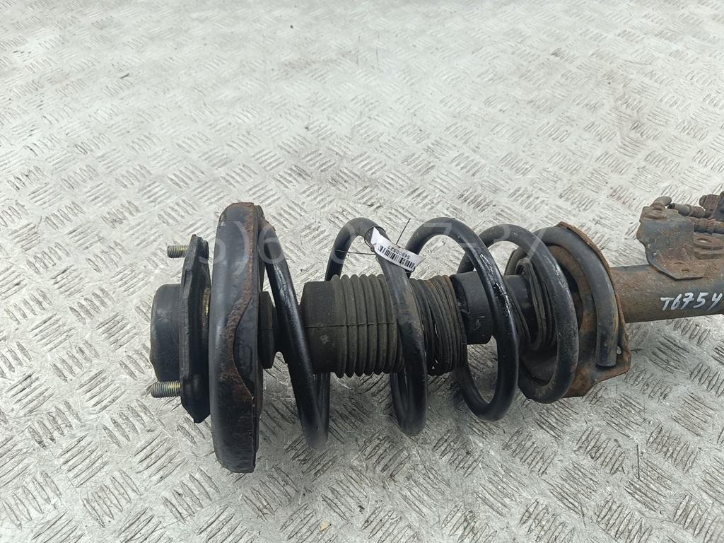 Амортизатор передний левый