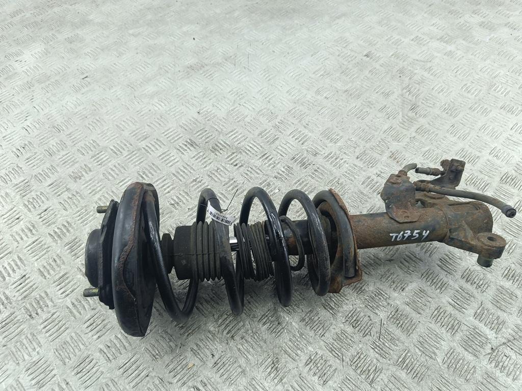 Амортизатор передний левый