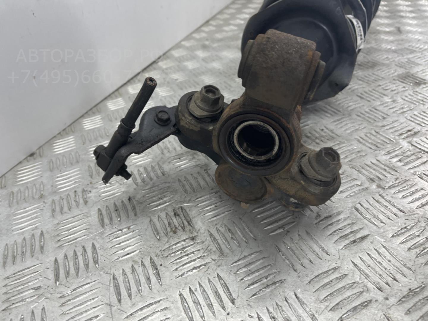 Амортизатор передний левый