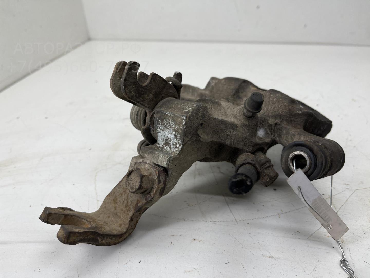 Суппорт задний левый