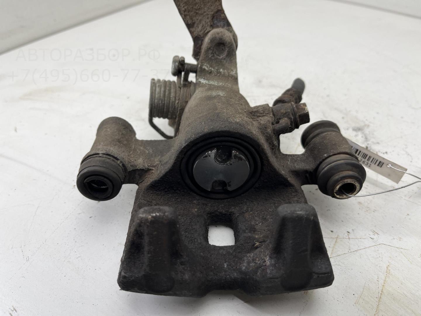 Суппорт задний левый