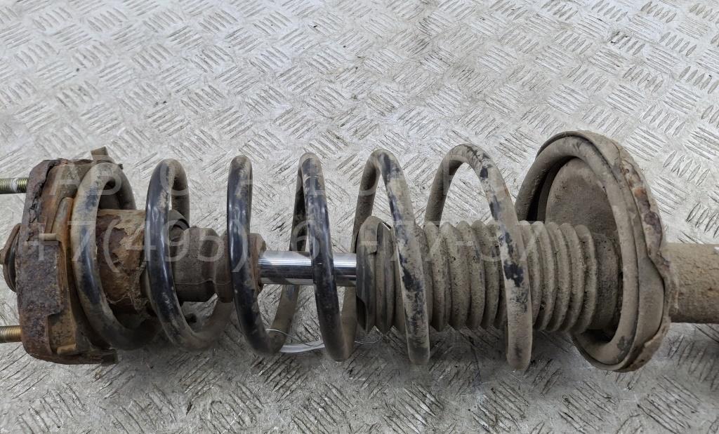 Амортизатор задний левый