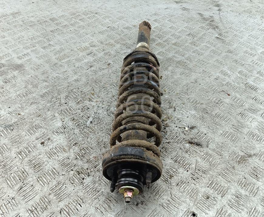Амортизатор задний левый