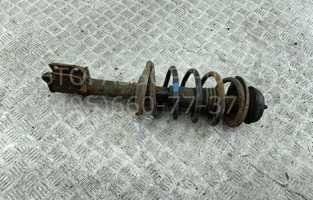 Амортизатор передний левый