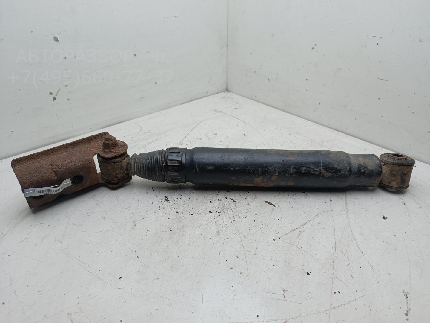 Амортизатор задний левый