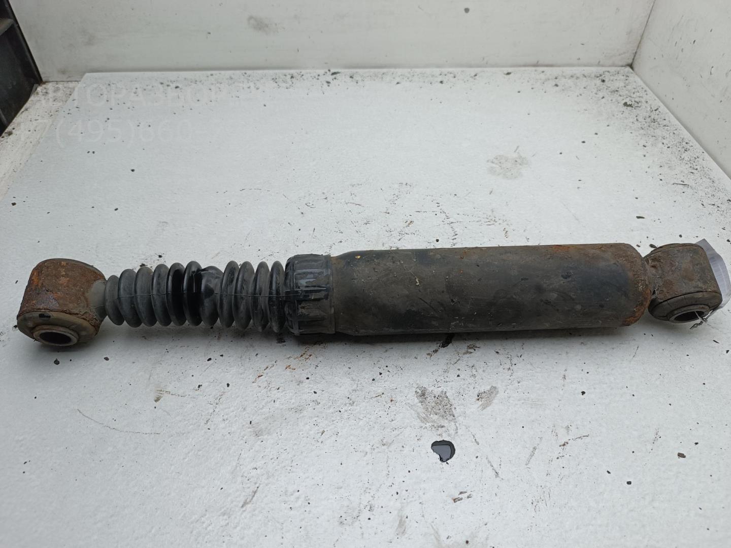 Амортизатор задний левый