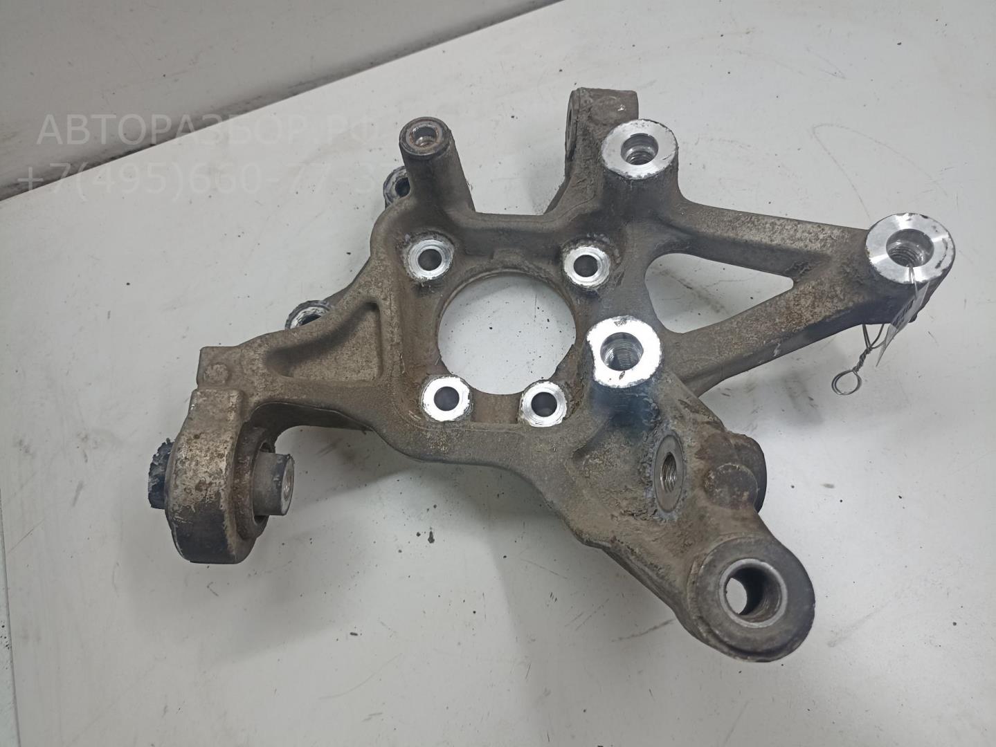 Кулак поворотный задний левый