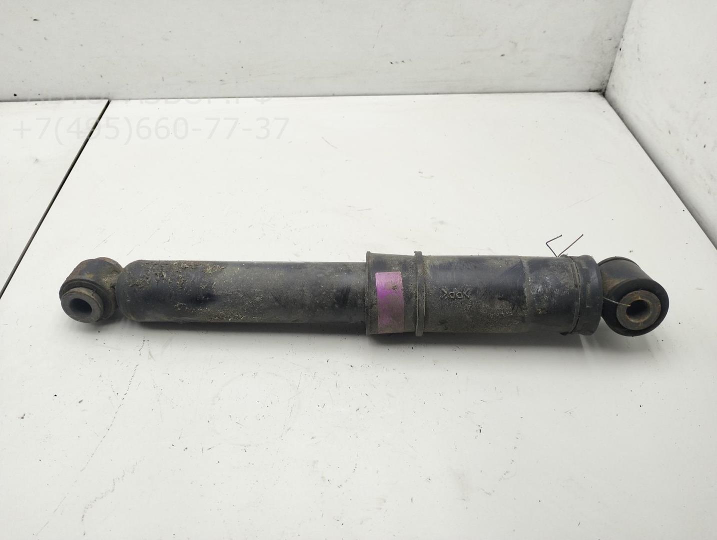 Амортизатор задний левый