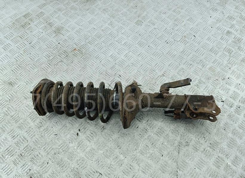 Амортизатор задний левый