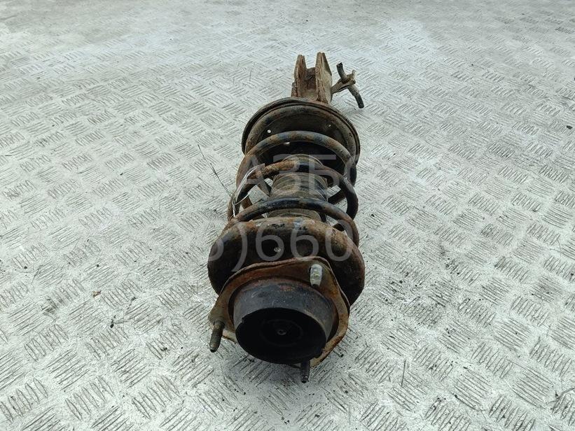 Амортизатор передний левый