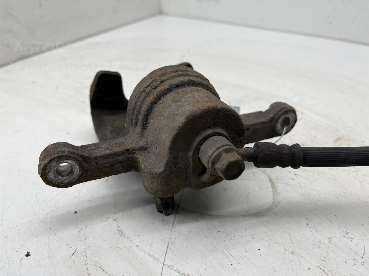 Суппорт задний левый