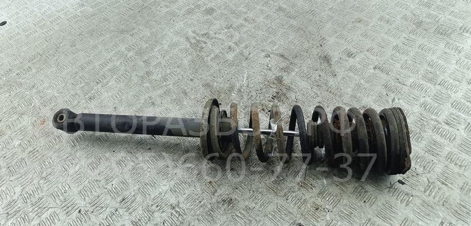 Амортизатор задний левый