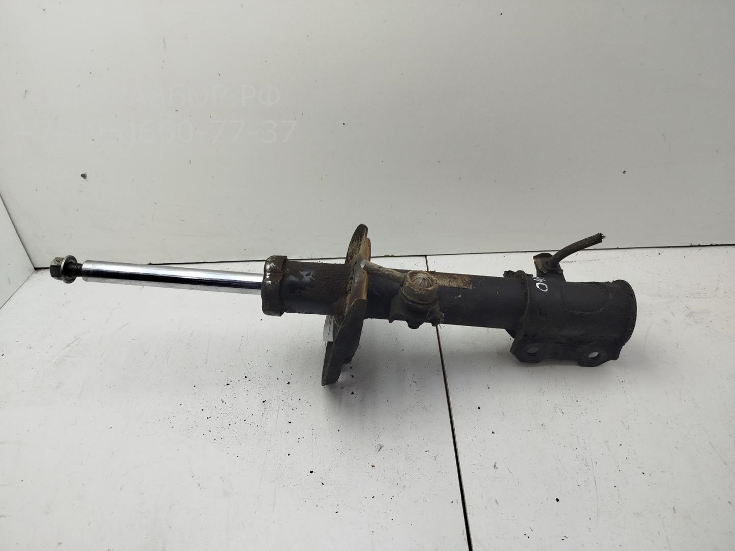 Амортизатор передний левый