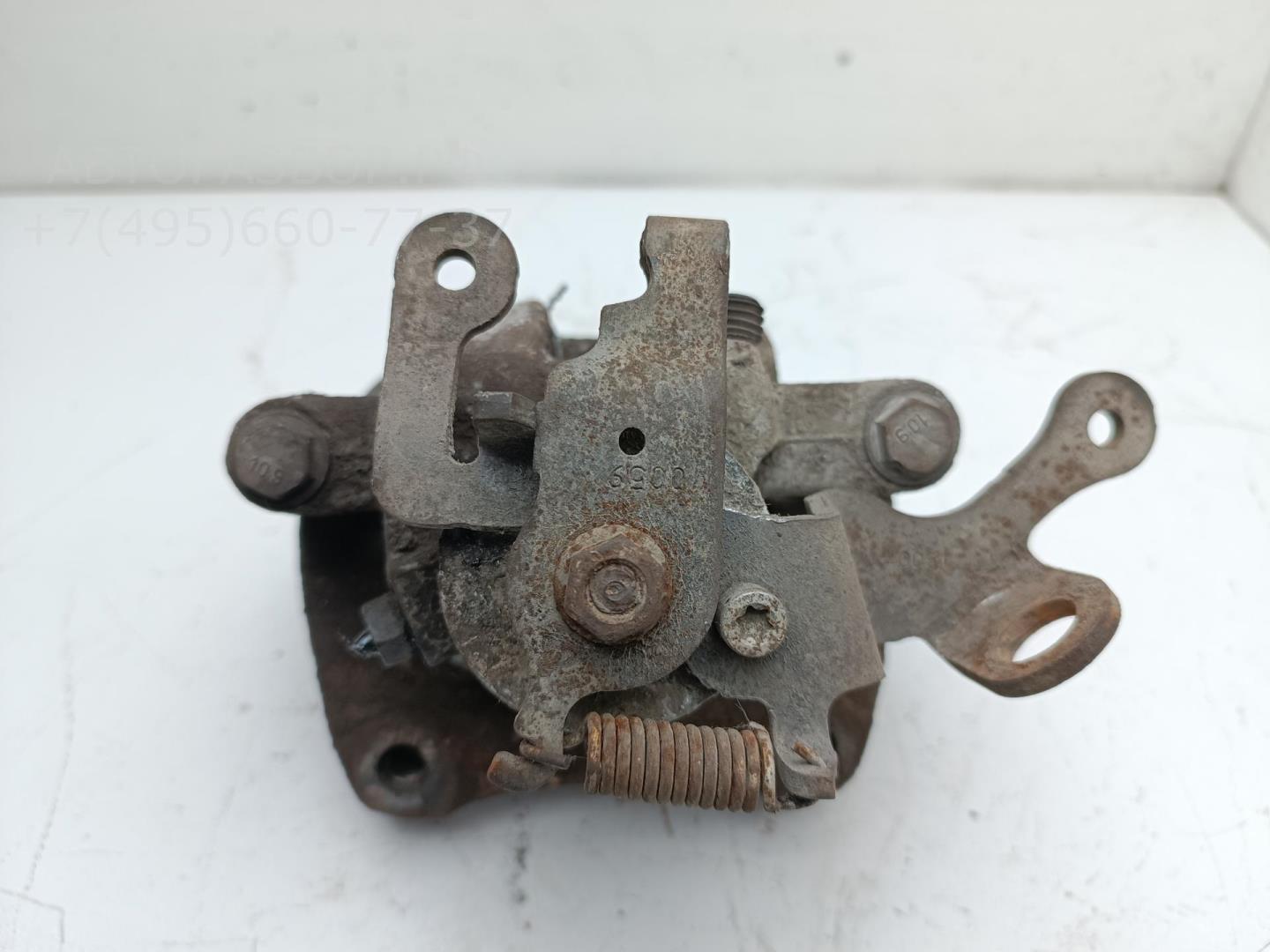 Суппорт задний левый