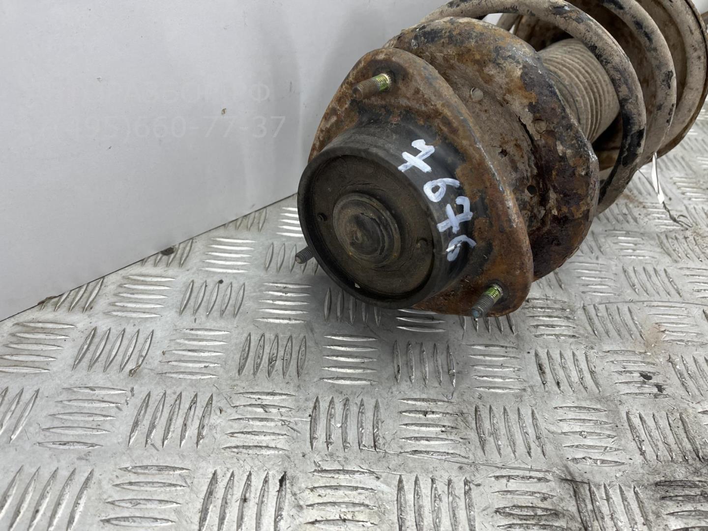 Амортизатор передний левый