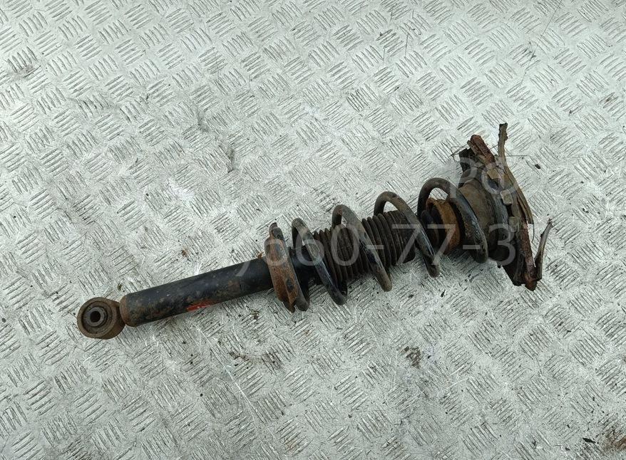 Амортизатор задний левый