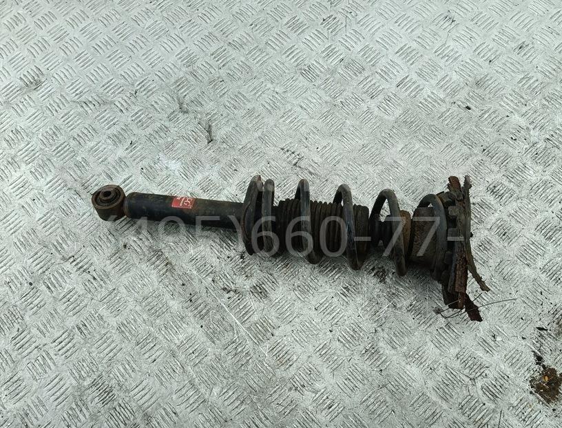 Амортизатор задний левый