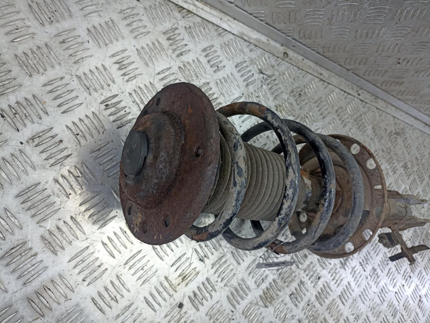 Амортизатор передний левый