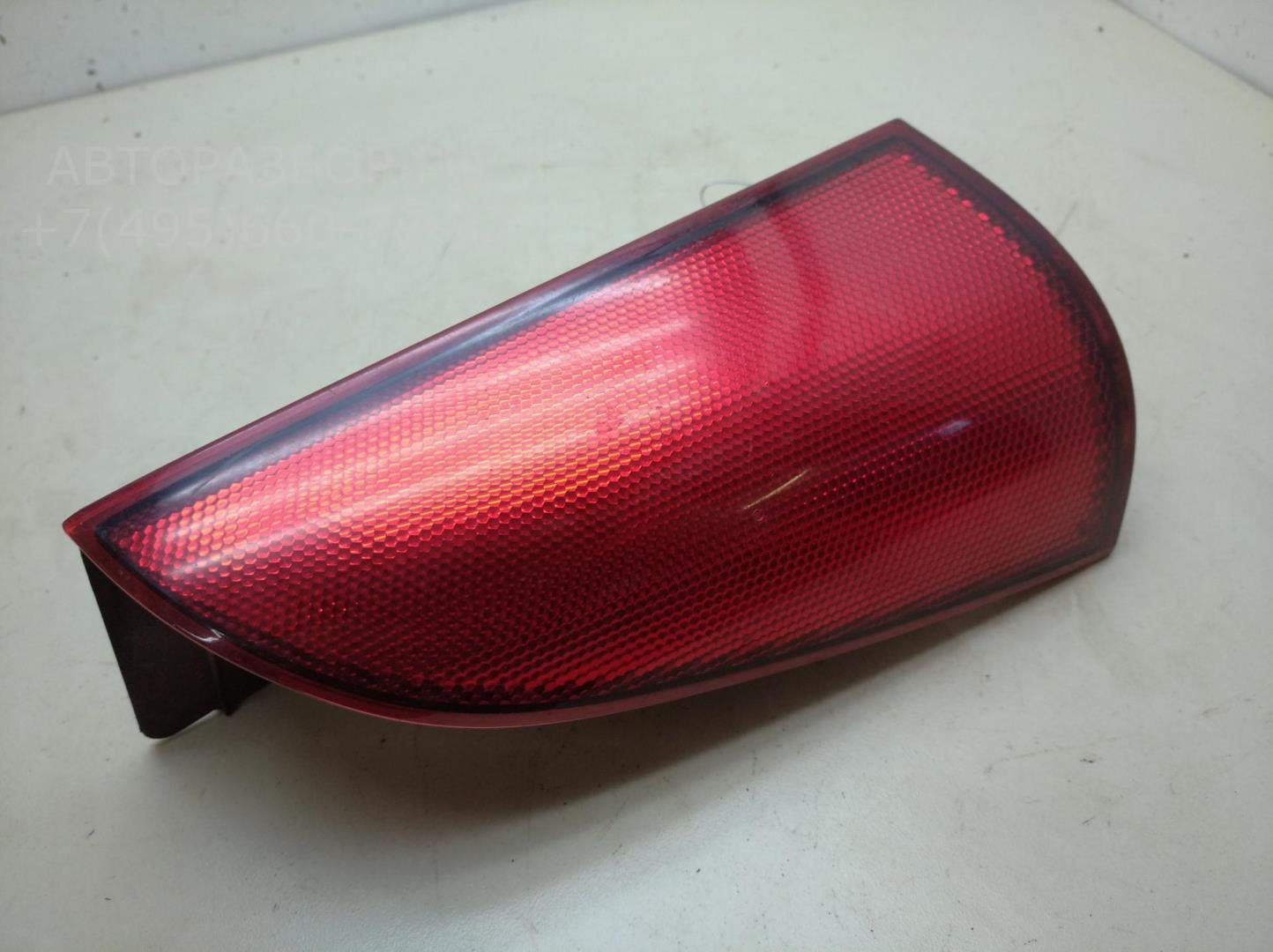 Отражатель в бампер задний левый