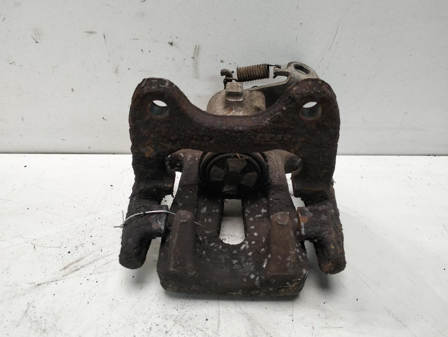 Суппорт задний левый