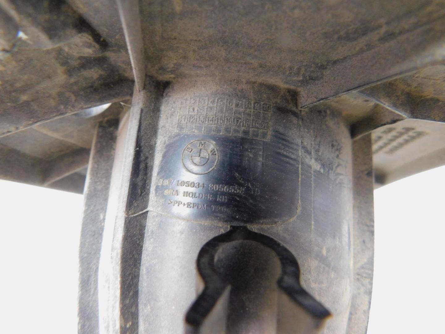 Кронштейн форсунки омывателя фары