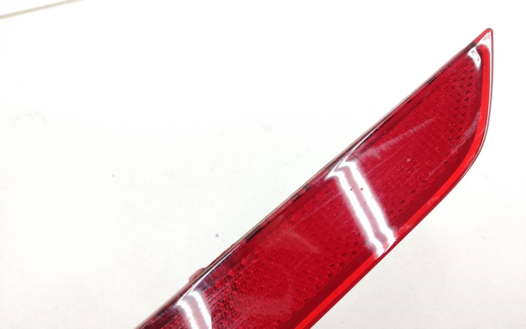 Отражатель в бампер задний левый