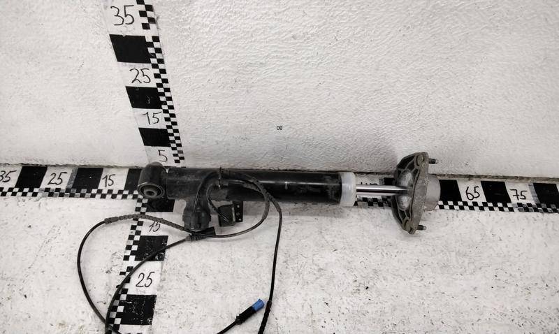 Амортизатор задний левый