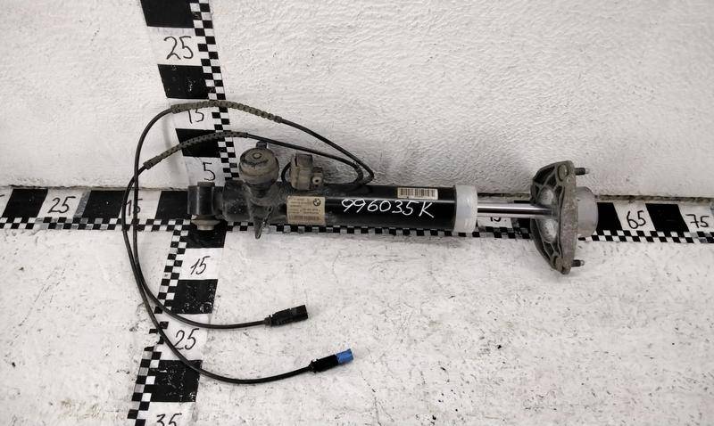 Амортизатор задний левый