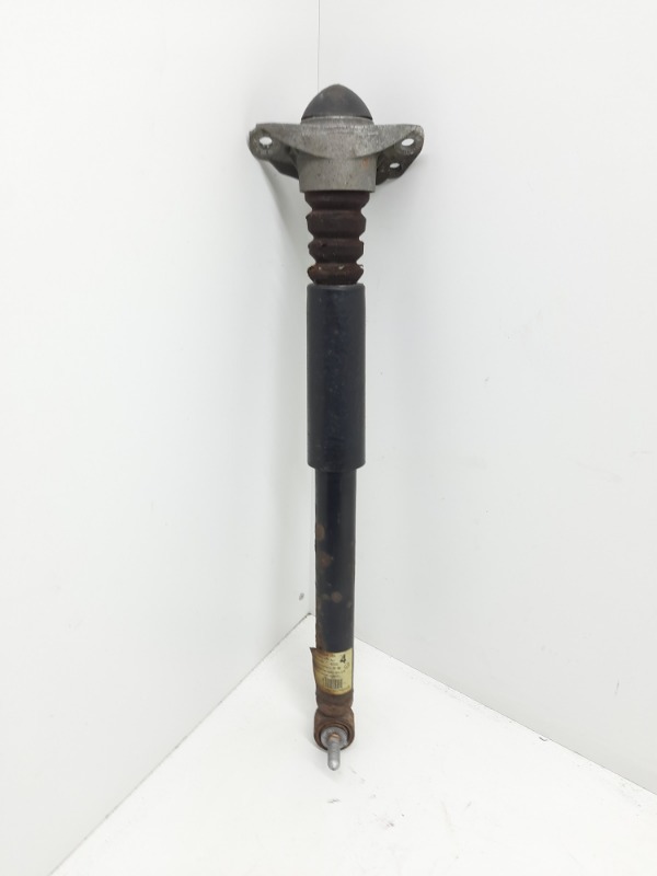 Амортизатор задний левый