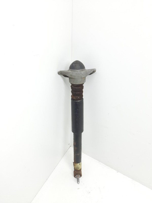 Амортизатор задний левый