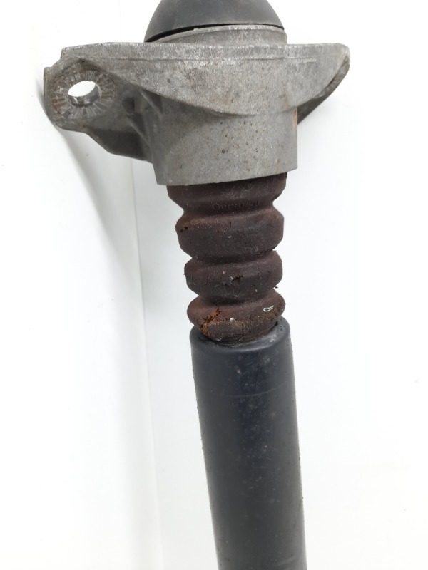 Амортизатор задний левый