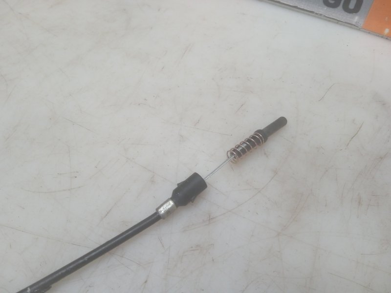 Трос лючка бензобака