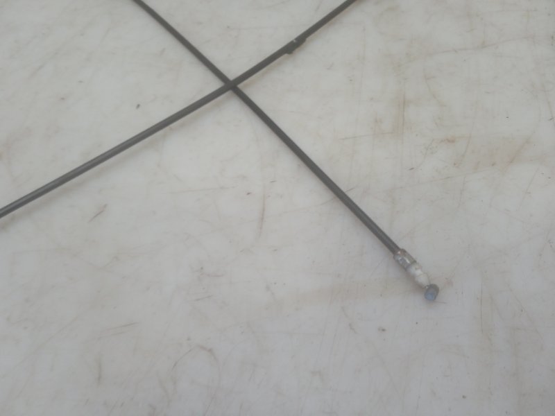 Трос лючка бензобака