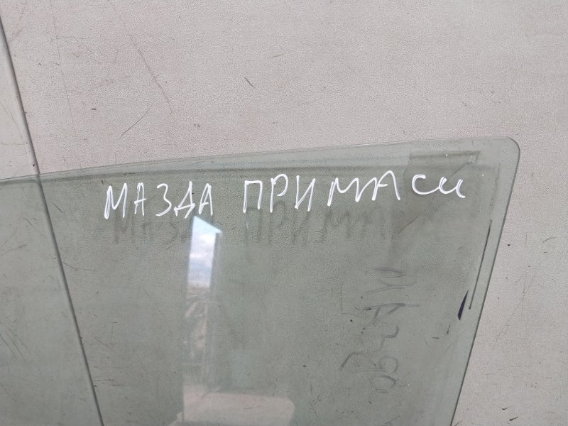 Стекло двери передней левой
