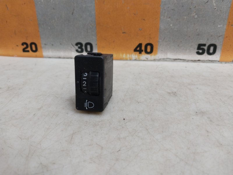 Кнопка корректора фар