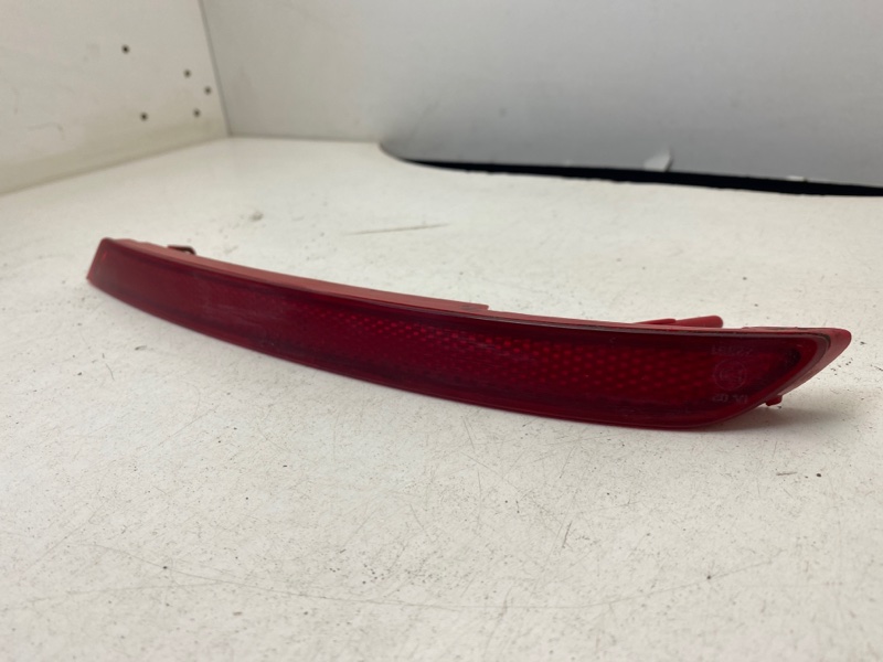 Отражатель в бампер задний левый