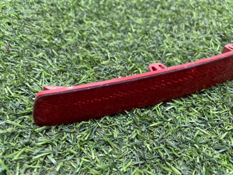 Отражатель в бампер задний левый